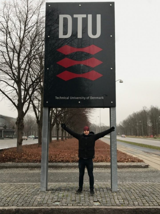 Connor standing in front of a Technical University of Denmark sign