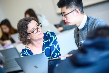 Student talking to professor 