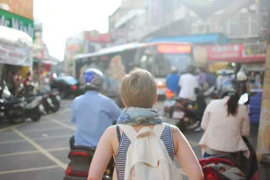 A student with a backpack exploring a new city