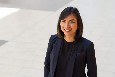 Portrait of student wearing a navy blazer and black shirt