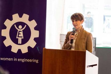 A guest speaker behind a lectern at a Women in Engineering event