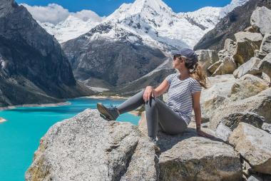 Woman enjoying the view of the mountains and lake during a hike