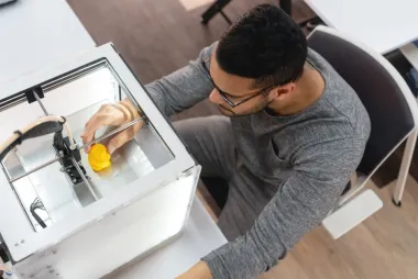 Man working with 3D printer