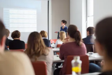 Students in a lecture hall during an information session