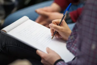 Student taking notes