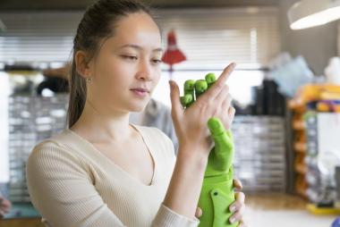 Student with hand prototype