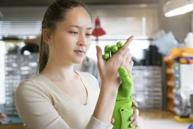 student with hand prototype