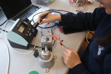 M2M member working on the electrical components of the prototypes