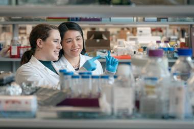 Two women examining sample in a lab