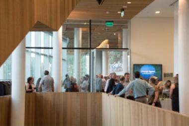 Group of people mingling in a foyer