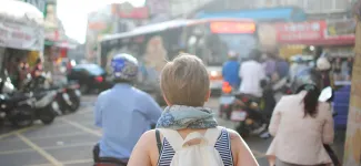 Student with a backpack exploring a new city