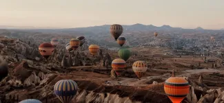 hot air balloons in the mountains