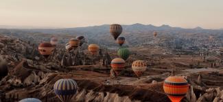 hot air balloons in the mountains