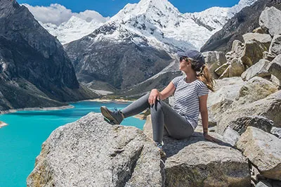 Woman enjoying the view of the mountains and lake during a hike