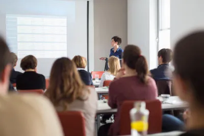Students in a lecture hall during an information session